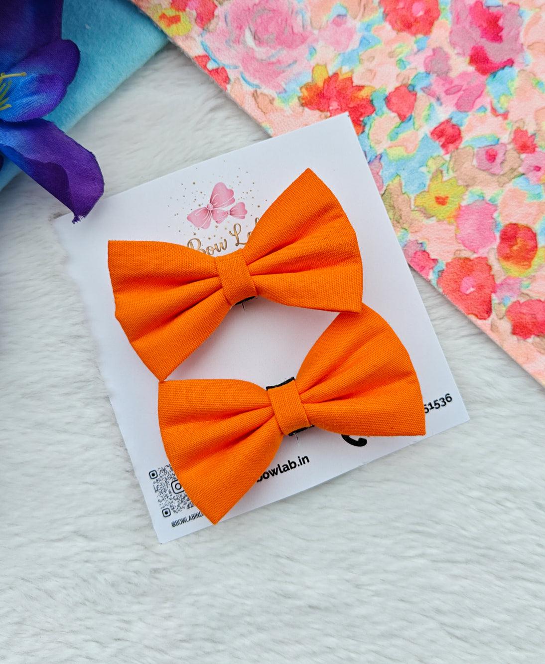 Chic Orange Bow Duo - Fashionable & Cheerful Hair Accessory Set Main image